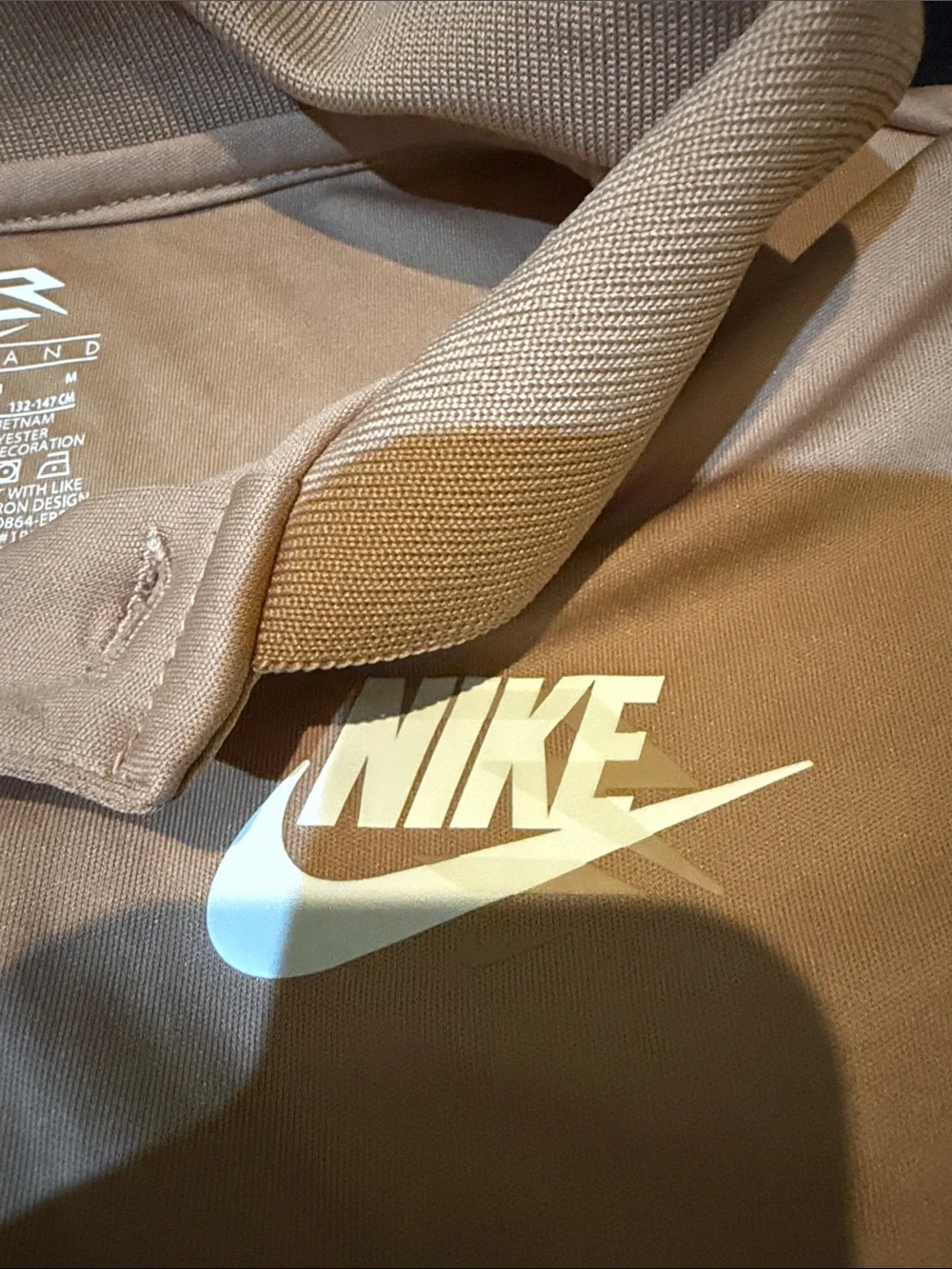 Nike Tan Polo Shirt with White Swoosh